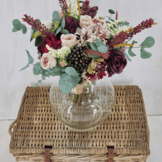 Flowergirl bouquet of plum and cream floral tones with berries and preserved eucalyptus